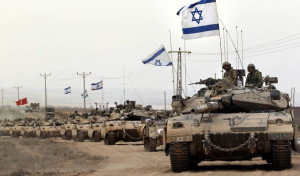 Israeli Merkava tanks near Israel-Gaza Strip border. (Credit: The Guardian)